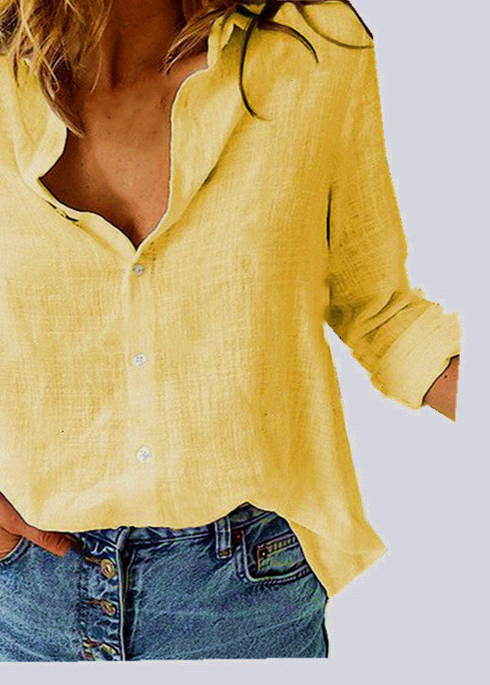 Person wearing a yellow shirt and blue jeans on a light gray background