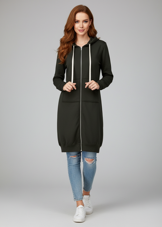 Woman wearing a black hoodie and jeans on a gray background