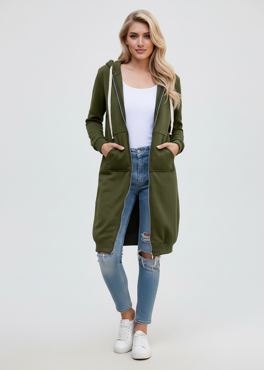 Woman wearing a long green hoodie with a plain background