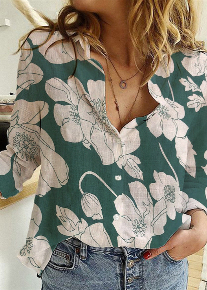 Woman wearing a floral blouse with a blurred indoor background