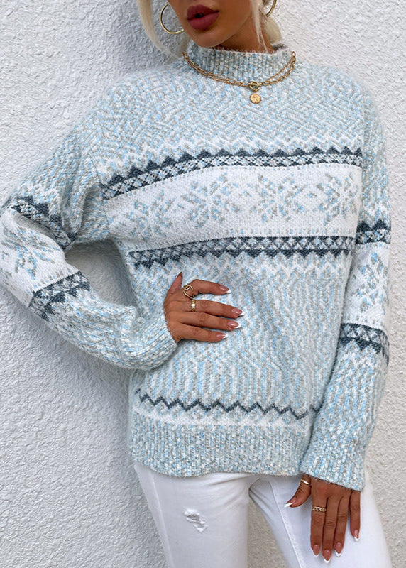 Light blue patterned sweater worn by a person against a white background