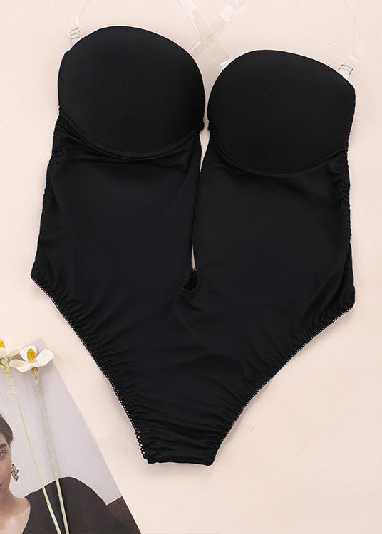 Black swimsuit on a beige background