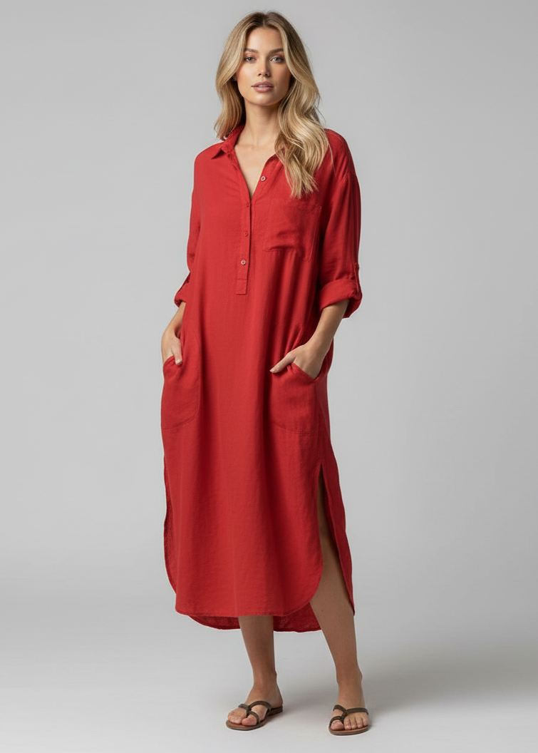 Woman wearing a red dress against a gray background