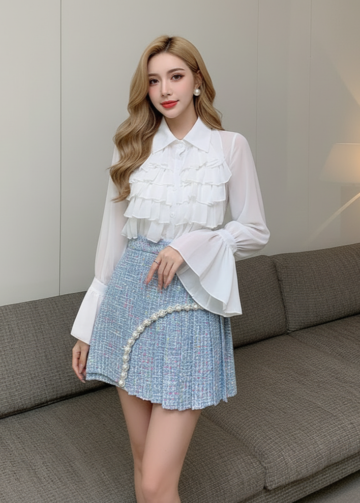 Woman wearing a white blouse and blue skirt in a living room setting